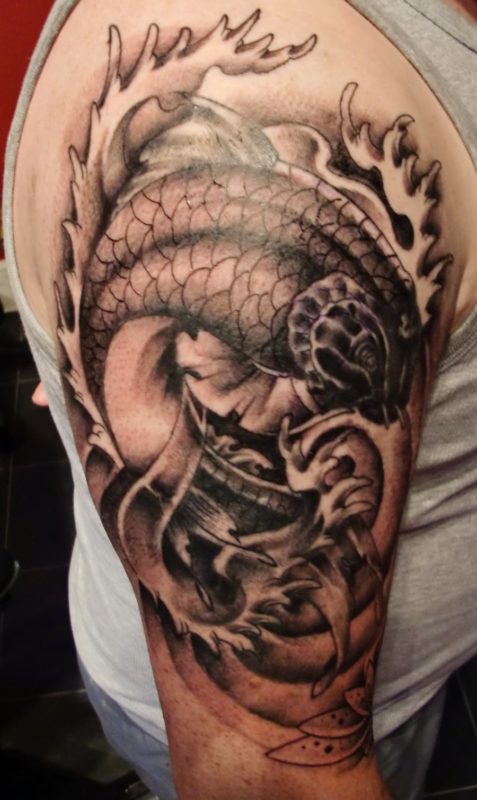 Amazing Black Fish Tattoo Design