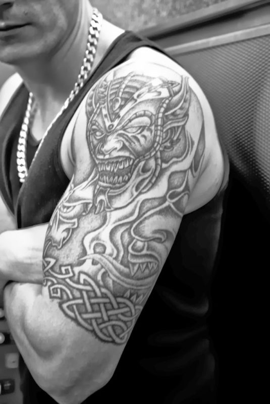 Black And White Tribal Shoulder Tattoo