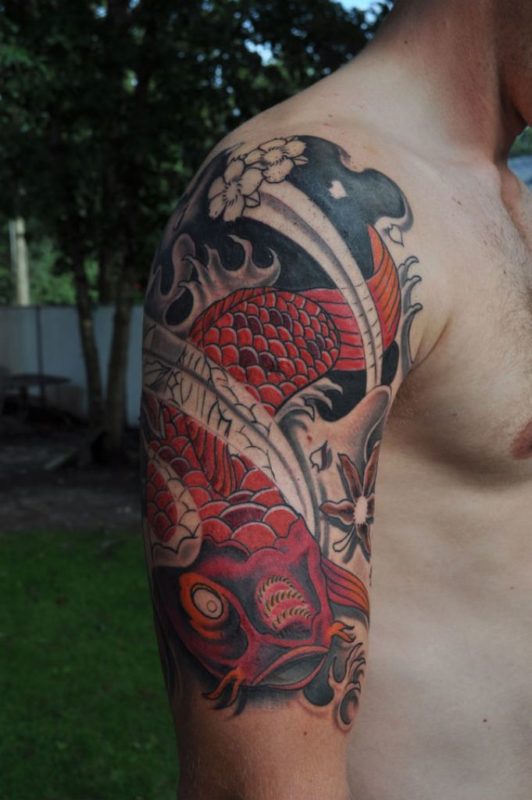 Beautiful Red Fish Tattoo On Shoulder