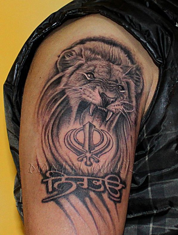 Black And Grey Lion Shoulder Tattoo