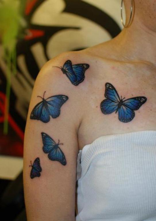 Blue Butterfly Tattoo On Right Shoulder