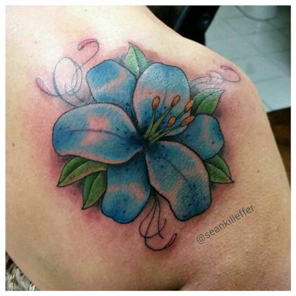 Blue Lily Tattoo On Back Shoulder