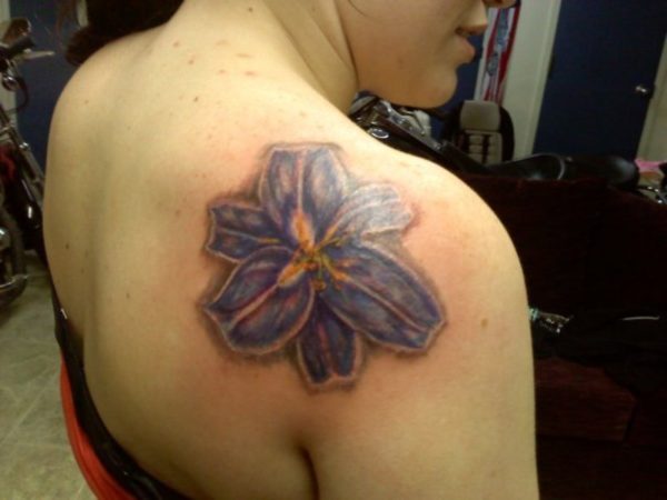 Blue Lily Tattoo On Right Shoulder