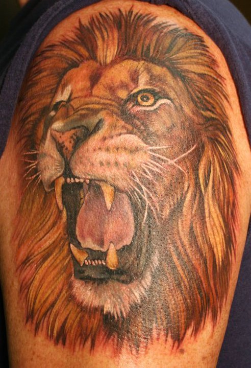 Colored Lion Face Shoulder Tattoo