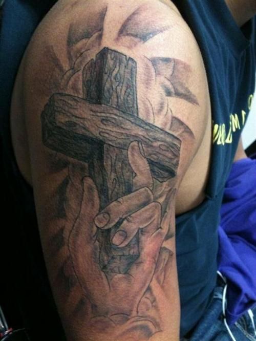 Cross In Hand Tattoo Design