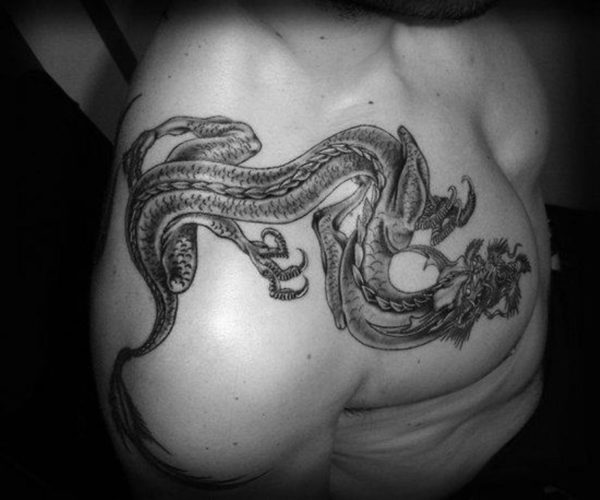 Cute Dragon Tattoo In Front Shoulder