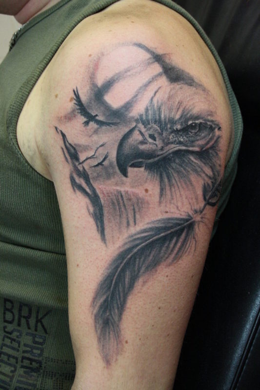 Eagle With Feather Tattoo Design