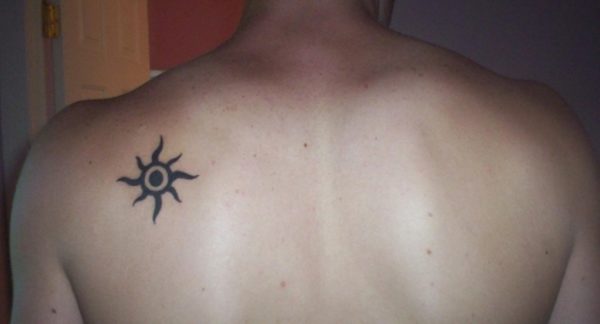 Glowing Black Sun Tattoo
