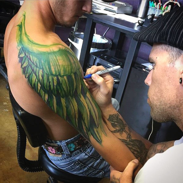 Green Colored Wings Tattoo