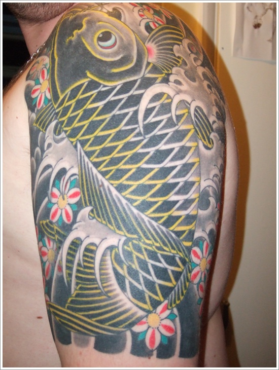 Green Fish Tattoo On Left Shoulder
