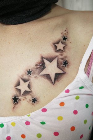 Grey And Black Star Shoulder Tattoo