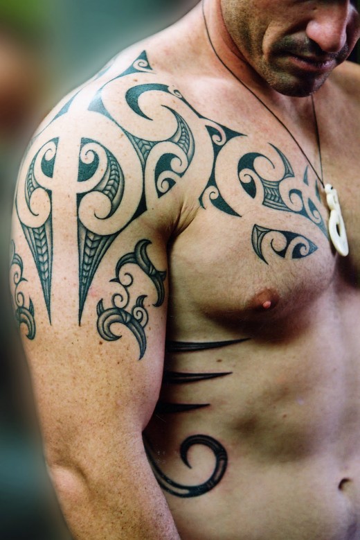 Grey And Black Tribal Shoulder Tattoo