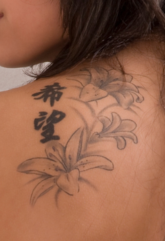 Grey Ink Lily Tattoo