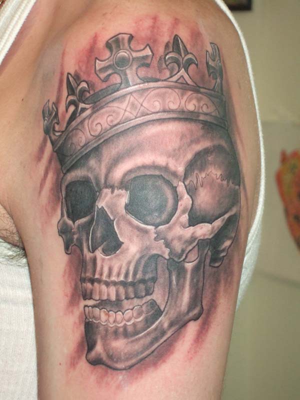 Grey Ink Skull And Crown Tattoo