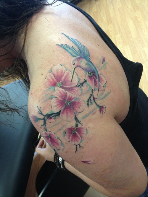 Hummingbird On Flower Tattoo Design