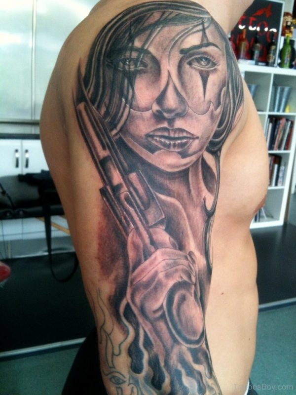 Lady With Gun Shoulder Tattoo