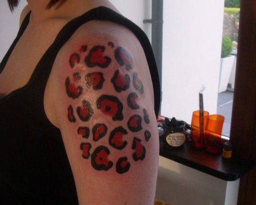 Leopard Spot Tattoo On Left Shoulder