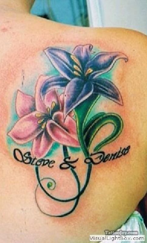 Lettering And Flower Tattoo On Shoulder