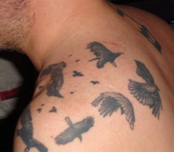 Lovely Flying Birds Tattoo On Left Shoulder