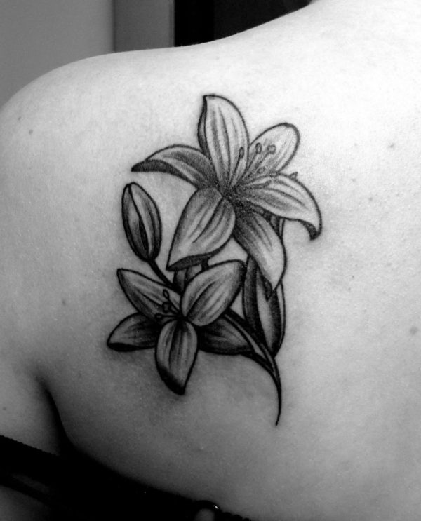 Nice Lily Tattoo On Back Shoulder
