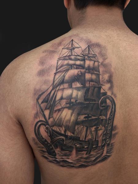 Octopus Attacking Ship Tattoo On Back Shoulder
