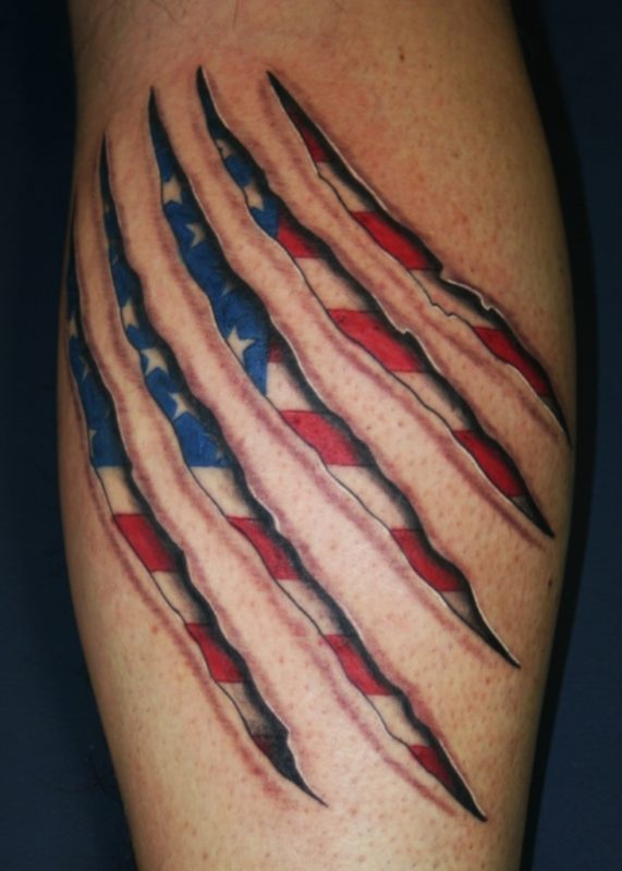 Patriotic Ripped Skin Tattoo On Shoulder