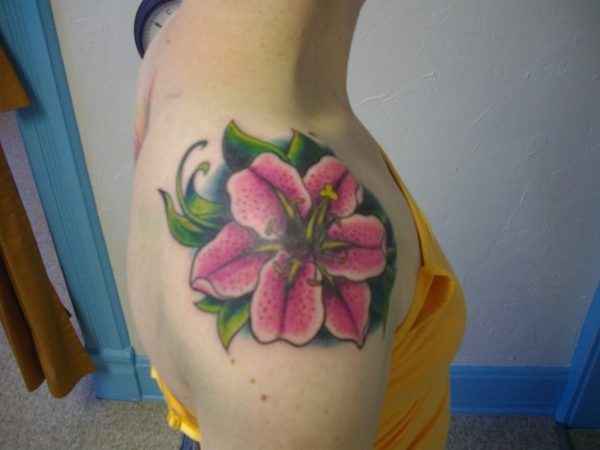 Pink Flower Tattoo On Front Shoulder