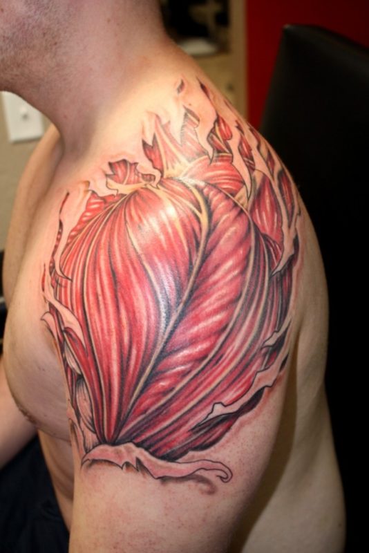 Rip Skin Muscle Tattoo On Right Shoulder