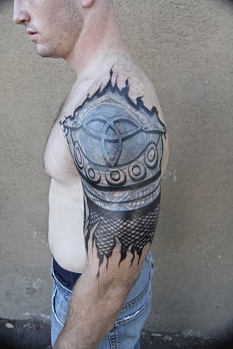 Ripped Skin Armour Tattoo Design
