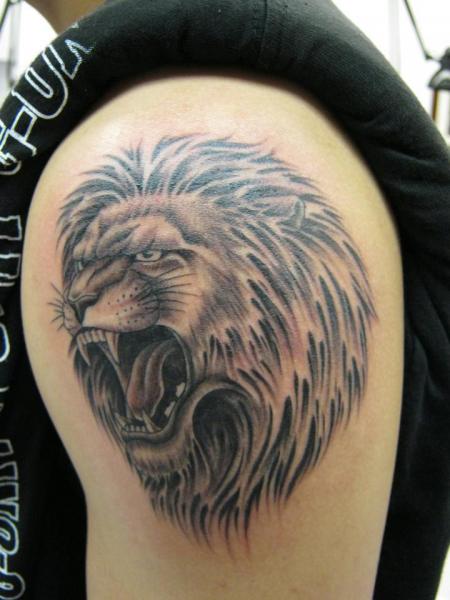 Roaring Black And Grey Lion Tattoo