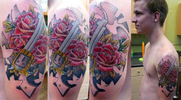 Roses And Gun Shoulder Tattoo