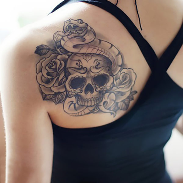 Skull With Flower And Snake Tattoo