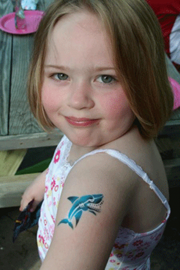 Small Girl With Left Shoulder Dolphin Tattoo