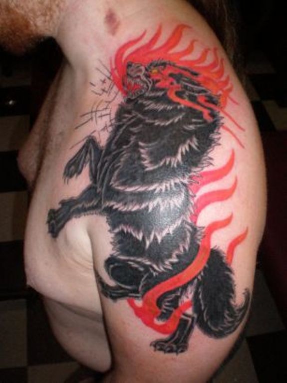 Stunning Black Wolf Tattoo