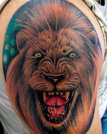 Stunning Lion Shoulder Tattoo