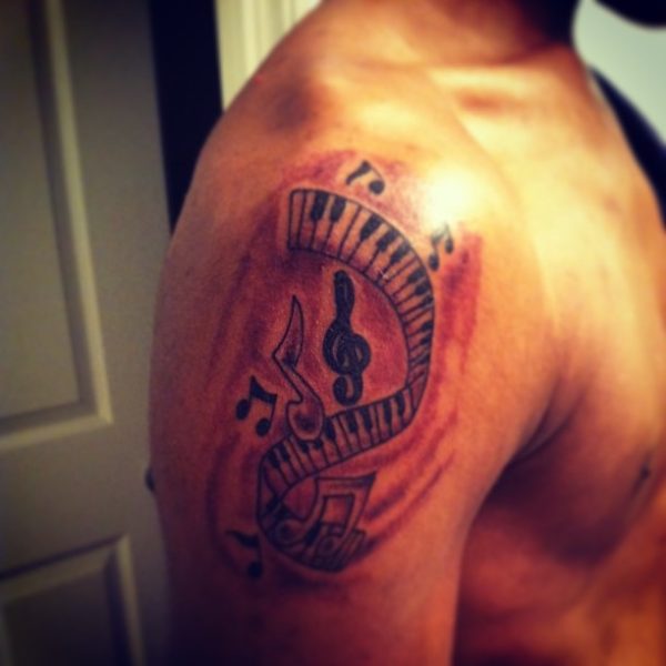 Stunning Musical Shoulder Tattoo Design