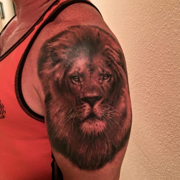 Stylish Black Lion Shoulder Tattoo