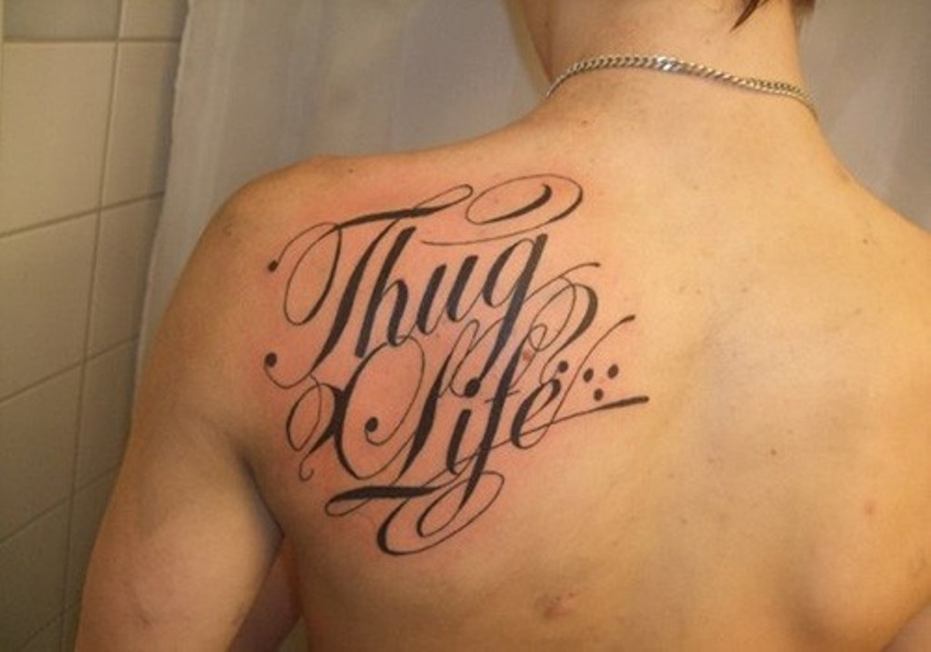 Thug Life Lettering Tattoo On Back Shoulder.