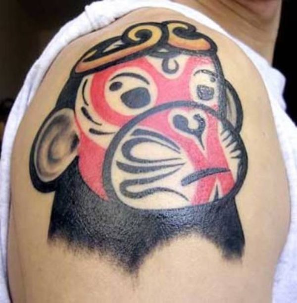 Red Monkey Face Shoulder Tattoo
