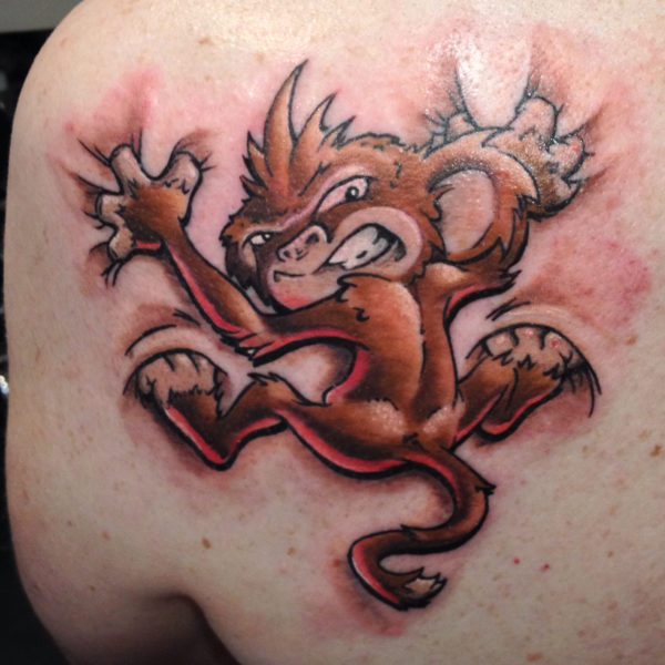 Ripped Skin Monkey Tattoo